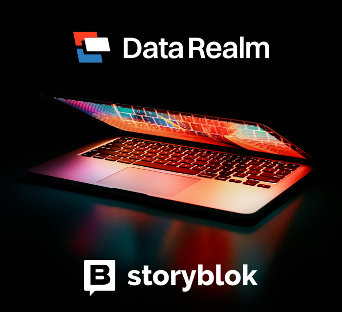 A partially open laptop emits colorful light in a dark setting, embodying a transformed website for Data Realm on Storyblok.